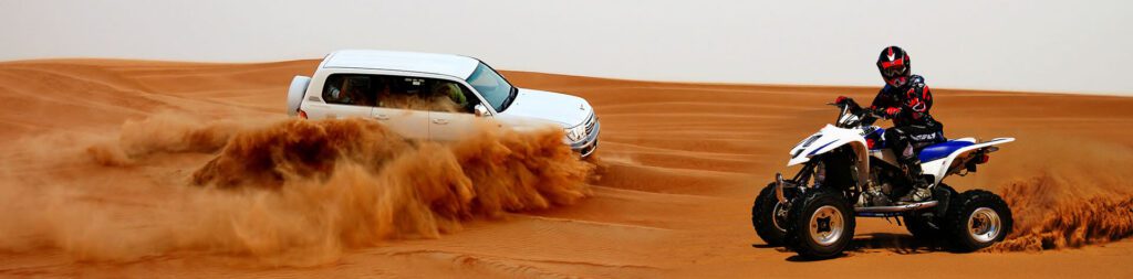 Sunrise Desert Safari Dubai A dynamic shot of a white SUV accelerating across a desert dune, creating a cloud of sand, illustrating a desert safari experience.