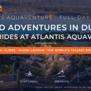 Atlantis Aquaventure waterpark aerial with Tower of Poseidon slides, Palm Jumeirah and Dubai Marina skyline - full-day thrill rides review 2026 by Mayra Tours
