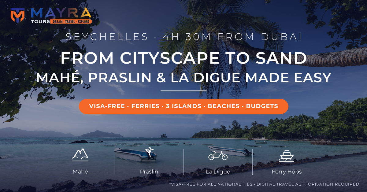 Palm tree over turquoise water and boats at Anse la Reunion, La Digue - Seychelles from Dubai island hopping guide 2026 for Mahe, Praslin and La Digue by Mayra Tours