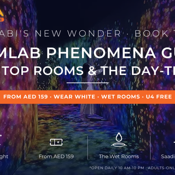 Visitor in white dress walking through a glowing corridor of projected flowers at teamLab Phenomena Abu Dhabi on Saadiyat Island - complete guide with tickets, what to wear and day trip from Dubai by Mayra Tours